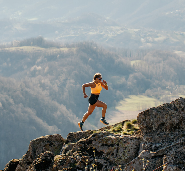 Woman Running on Mountain